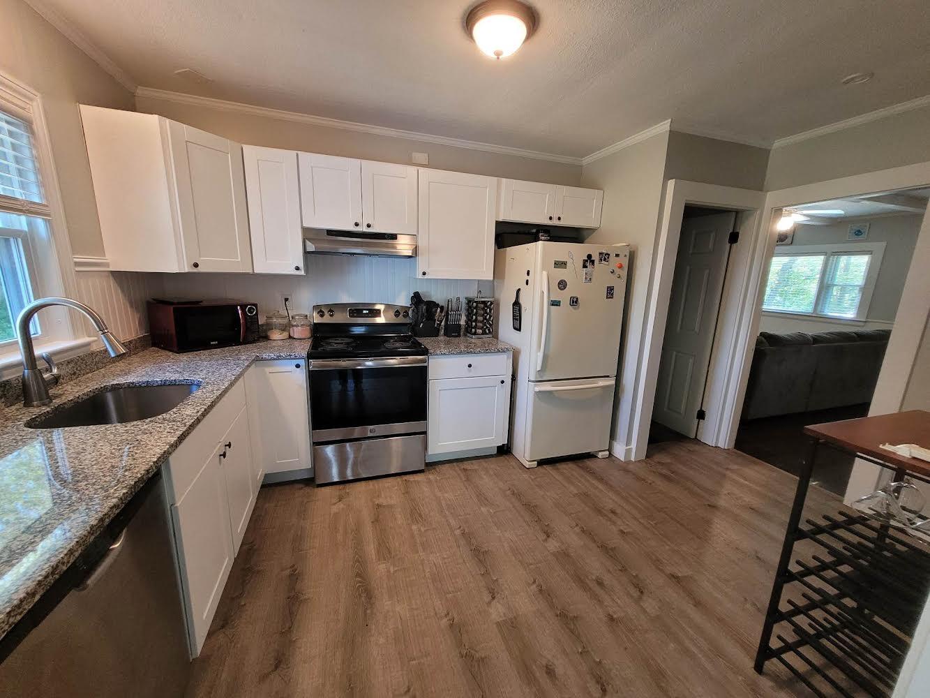 52 Ploughed Neck Road East Sandwich, MA 02537 - Photo 8 of 20 a large kitchen with a stove a refrigerator and a sink
