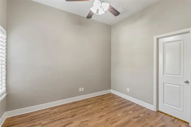 a bathroom with a granite countertop toilet a sink and a mirror