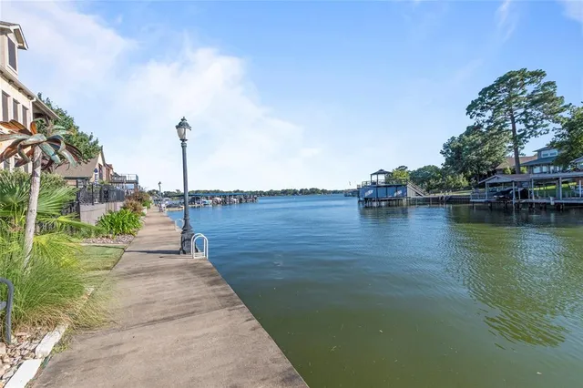 a view of terrace with lawn chairs and mountain view