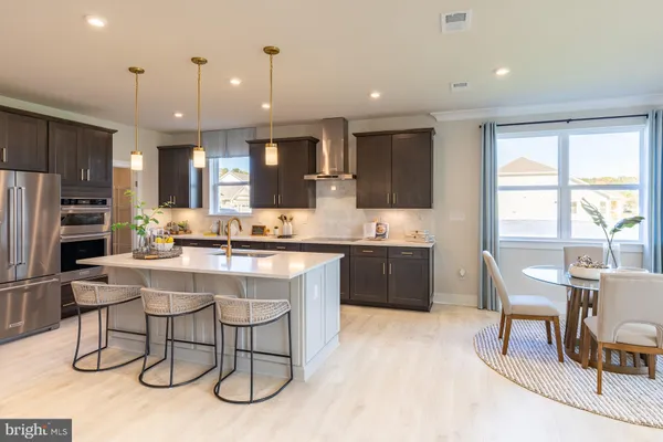 a kitchen with a sink cabinets and window