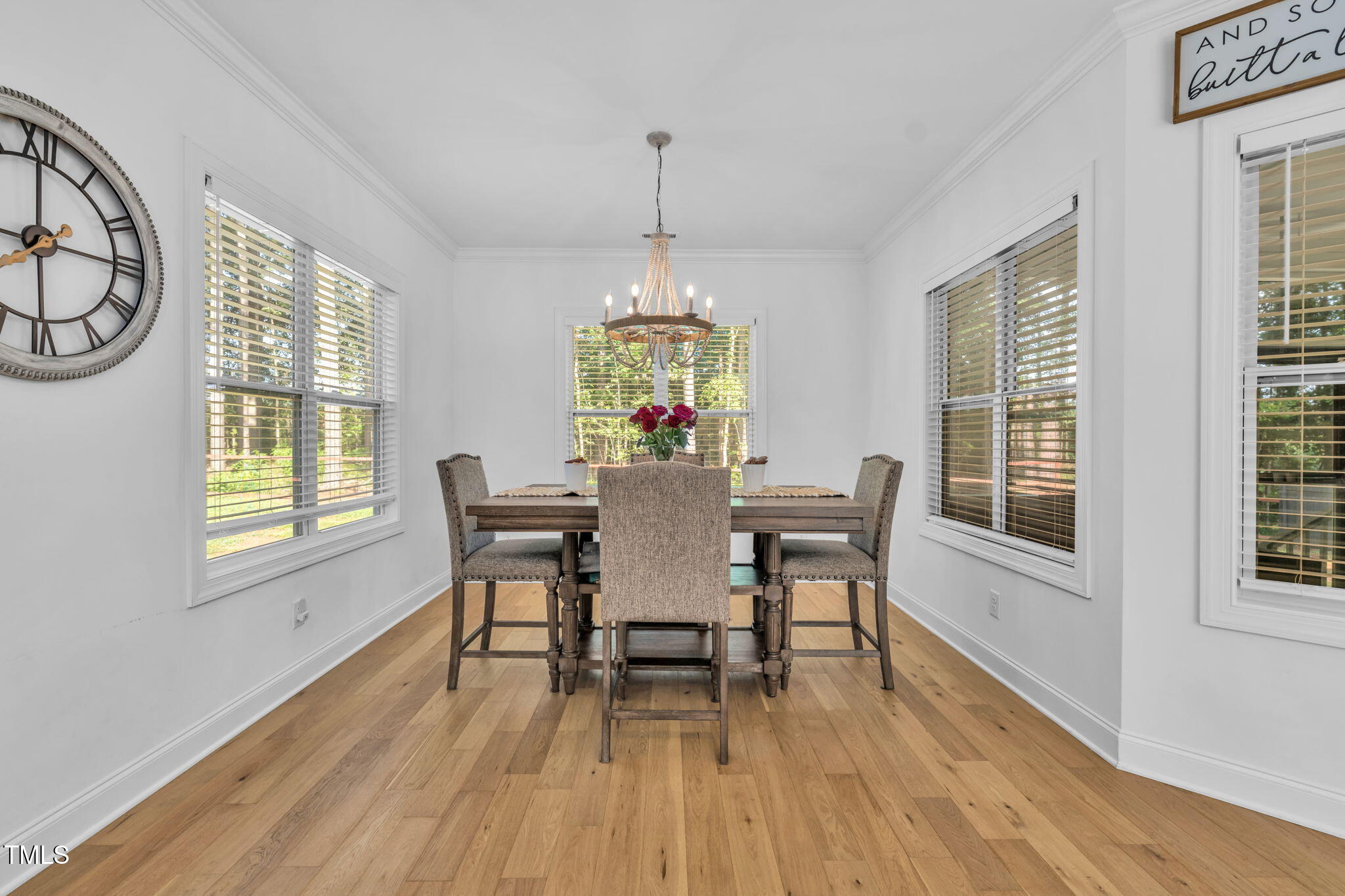 45 Tamaran Ct Spring Spring Hope, NC 27882 - Photo 11 of 35 a dining room with furniture a chandelier and wooden floor