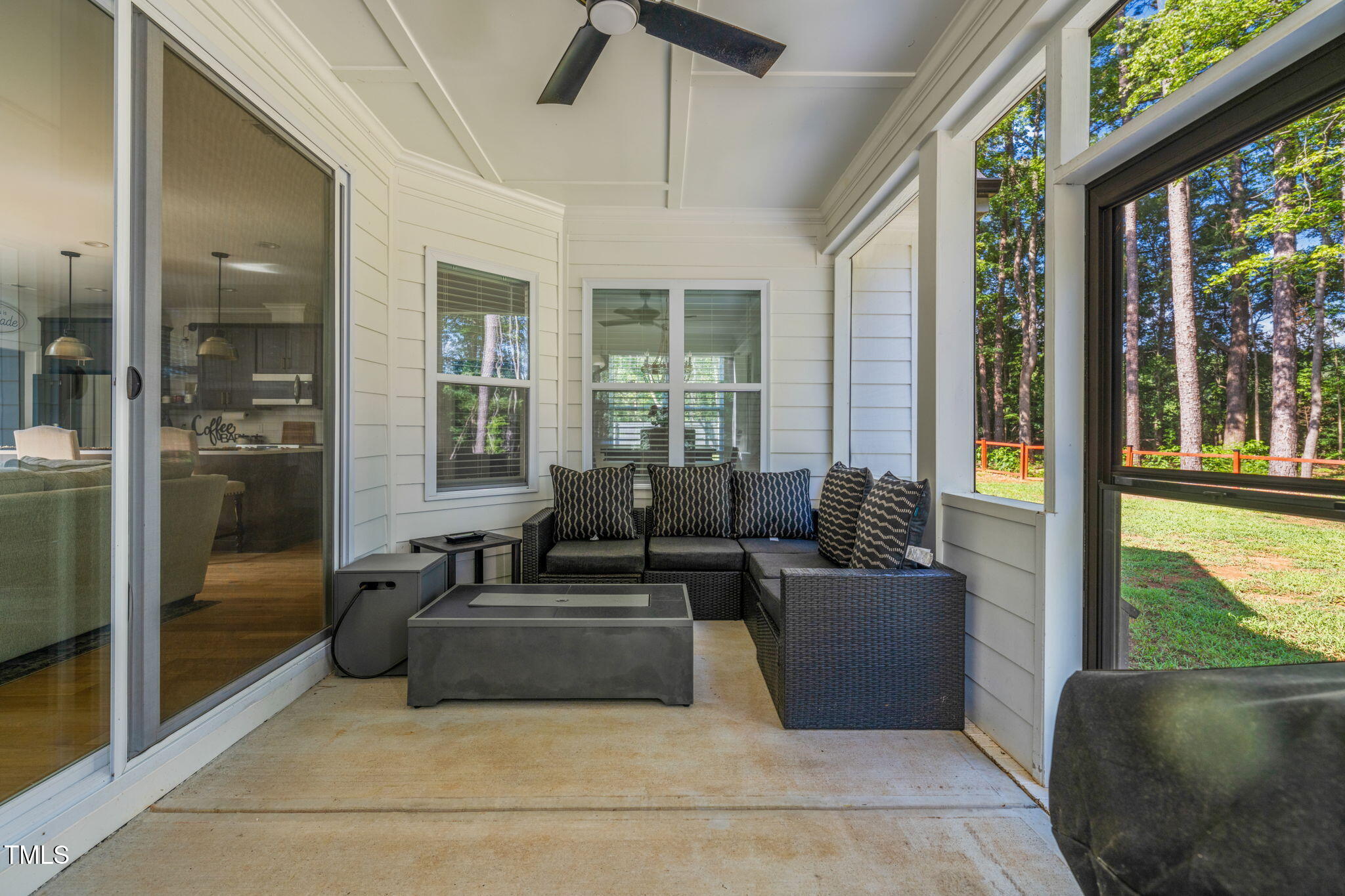 45 Tamaran Ct Spring Spring Hope, NC 27882 - Photo 27 of 35 a living room with furniture and a floor to ceiling window