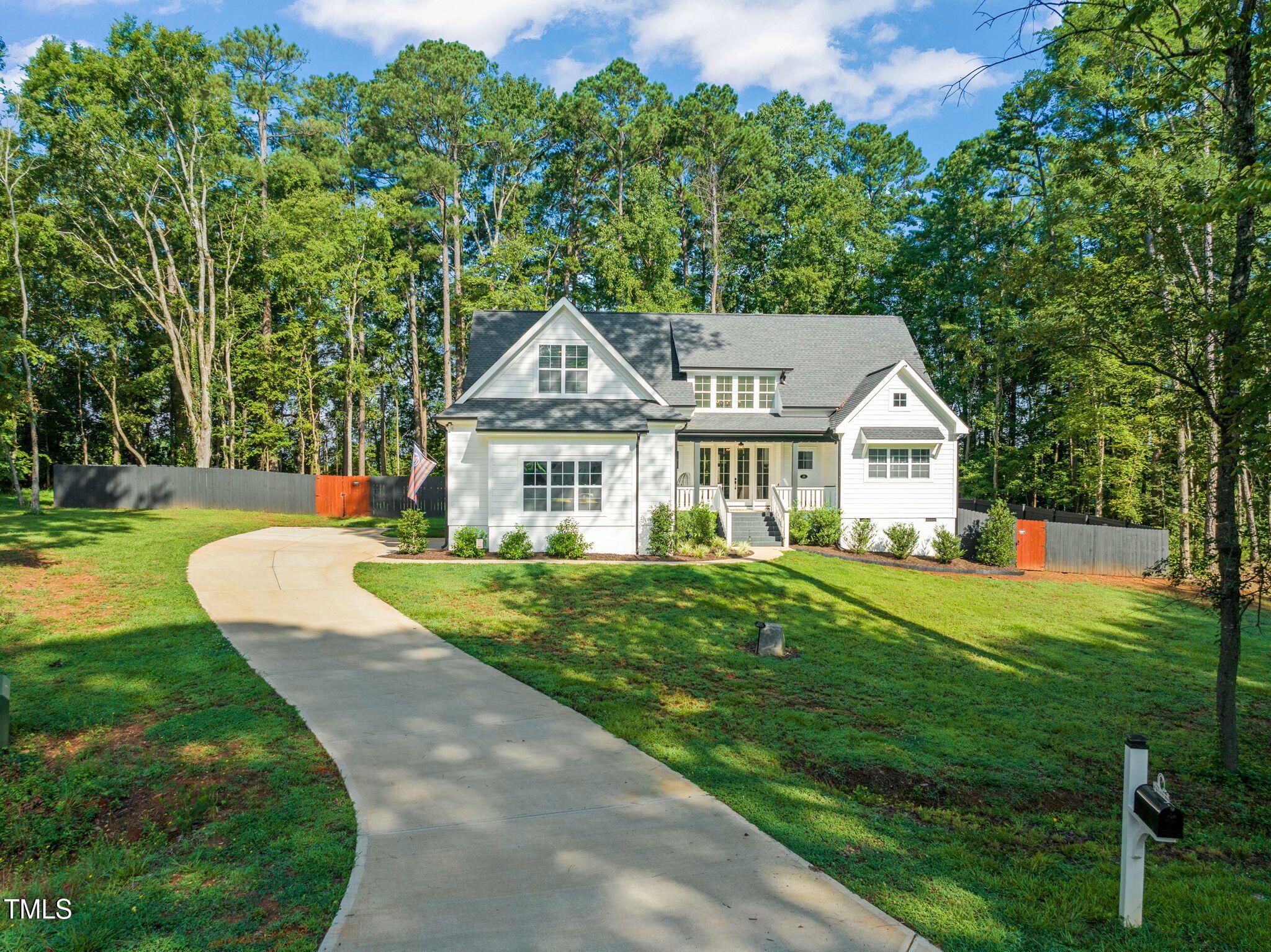 45 Tamaran Ct Spring Spring Hope, NC 27882 - Photo 2 of 35 a front view of a house with a yard table and chairs