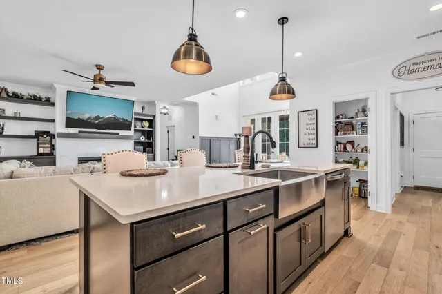a kitchen with a sink and a stove