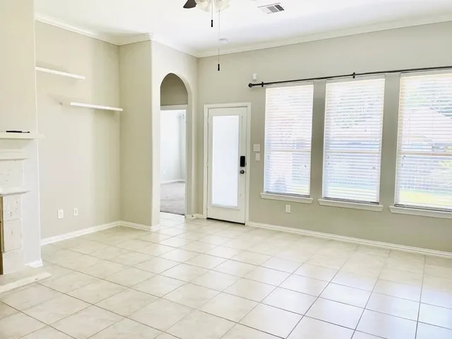 a view of an empty room and window