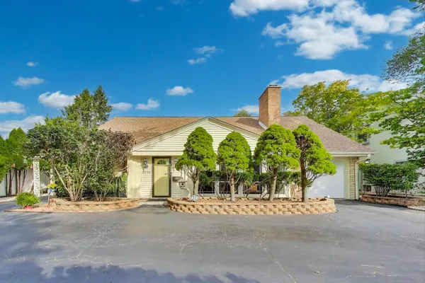 front view of a house with a garden