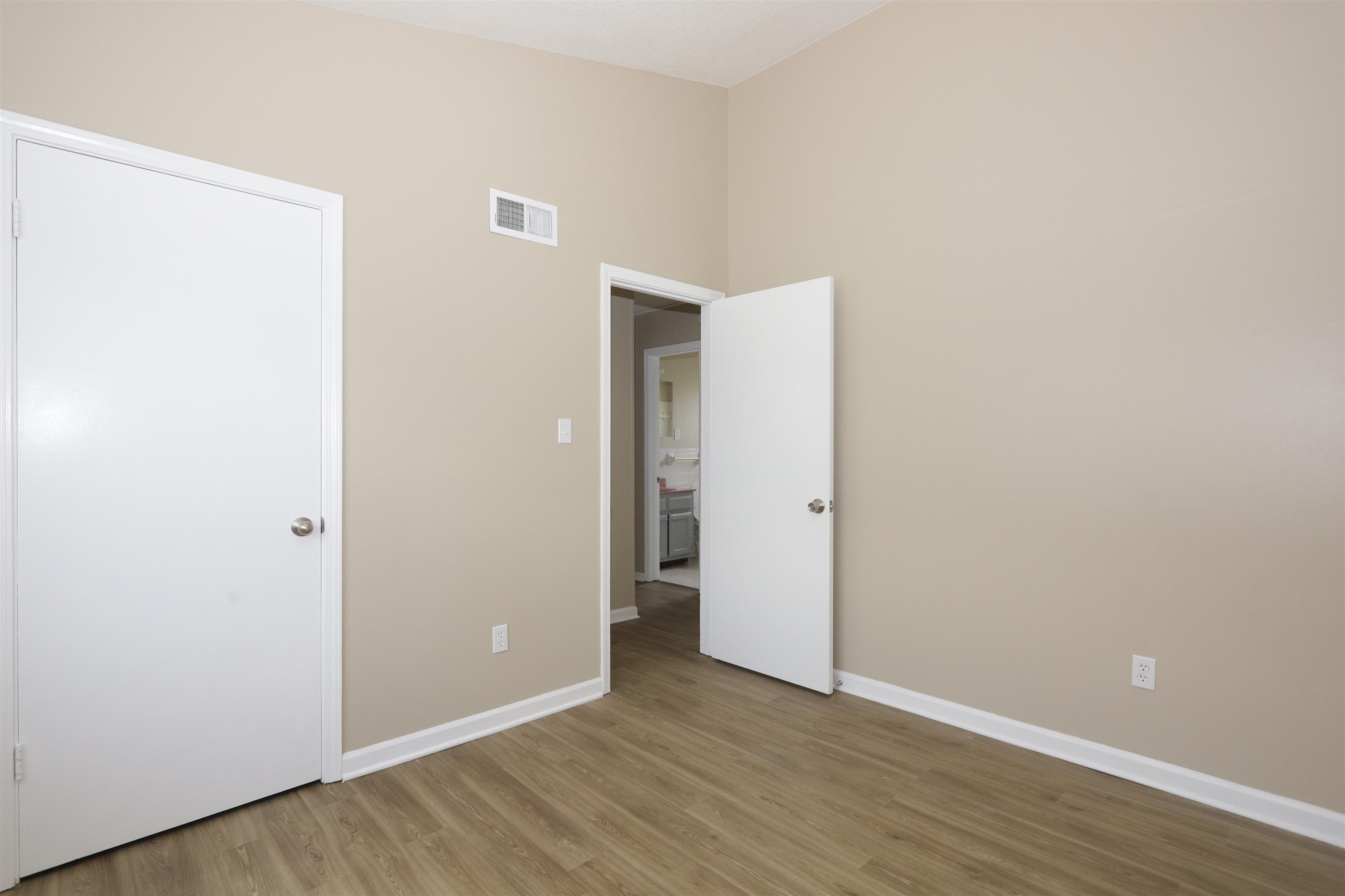 5142 Fairley Road Memphis, TN 38109 - Photo 12 of 13 a view of an empty room with wooden floor
