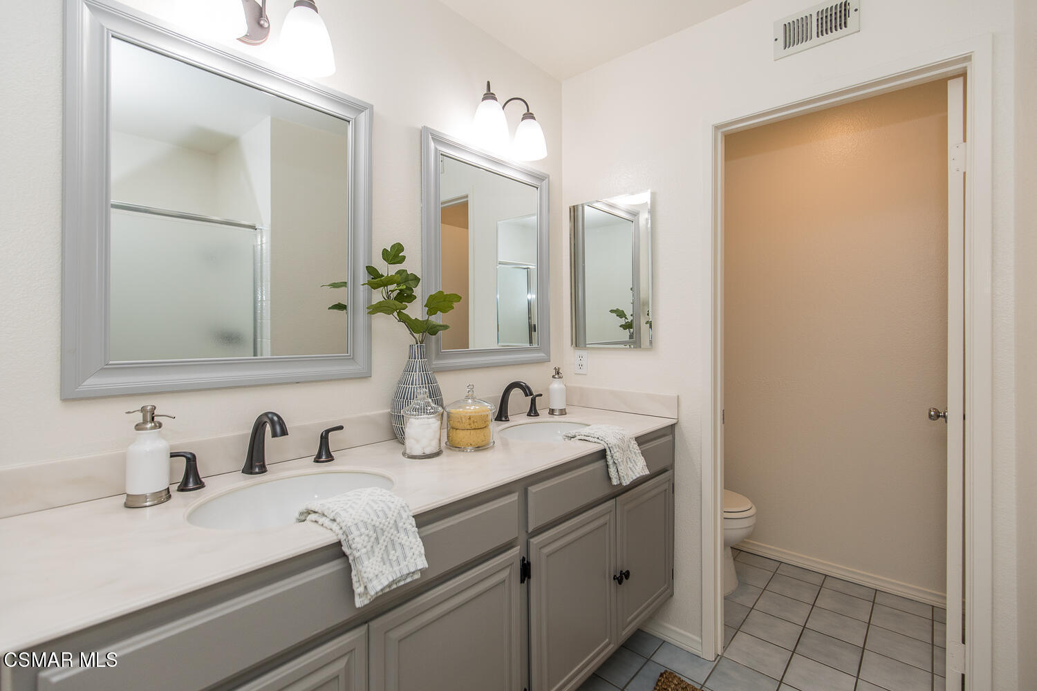 12617 Crystal Ranch Road Moorpark, CA 93021 - Photo 13 of 34 a bathroom with a sink and a mirror