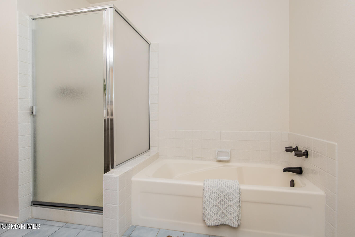 12617 Crystal Ranch Road Moorpark, CA 93021 - Photo 14 of 34 a bathroom with a bathtub and a shower
