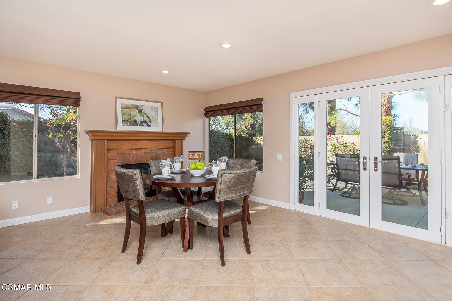 12617 Crystal Ranch Road Moorpark, CA 93021 - Photo 21 of 34 a dining room with furniture a floor to ceiling window and outside view