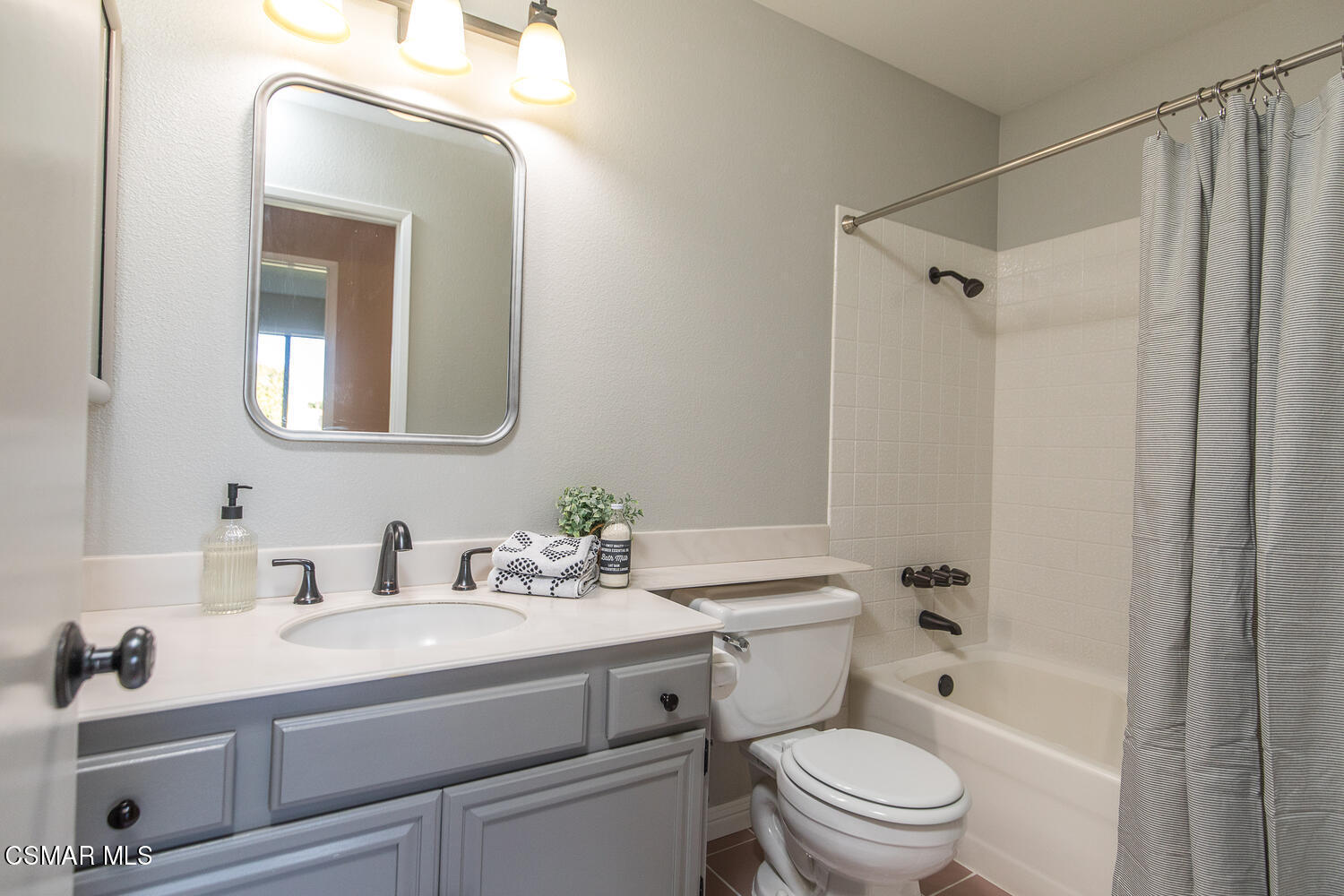 12617 Crystal Ranch Road Moorpark, CA 93021 - Photo 28 of 34 a bathroom with a toilet a sink a mirror a bathtub and vanity