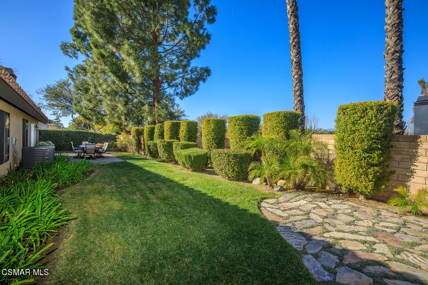 12617 Crystal Ranch Road Moorpark, CA 93021 - Photo 32 of 34 a view of a garden with a building in the background