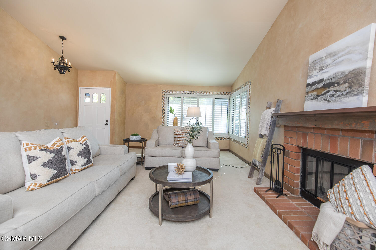 12617 Crystal Ranch Road Moorpark, CA 93021 - Photo 10 of 34 a living room with furniture and a fireplace
