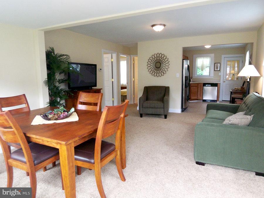 228 Carvel Road Pasadena, MD 21122 - Photo 4 of 20 Seamless Flow into Light-Filled Dining Room