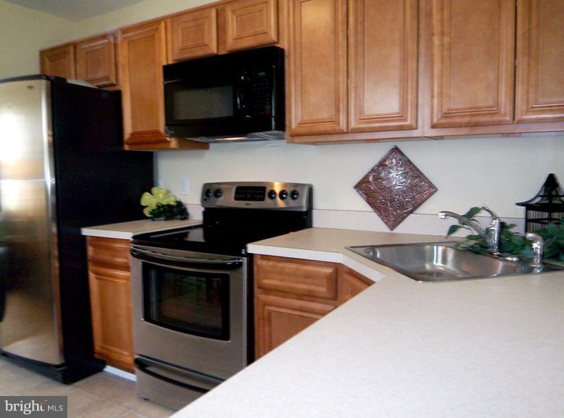 228 Carvel Road Pasadena, MD 21122 - Photo 5 of 20 Revamped Kitchen Boasting Stainless Appliances
