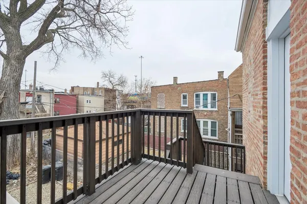 a view of a balcony with wooden floor