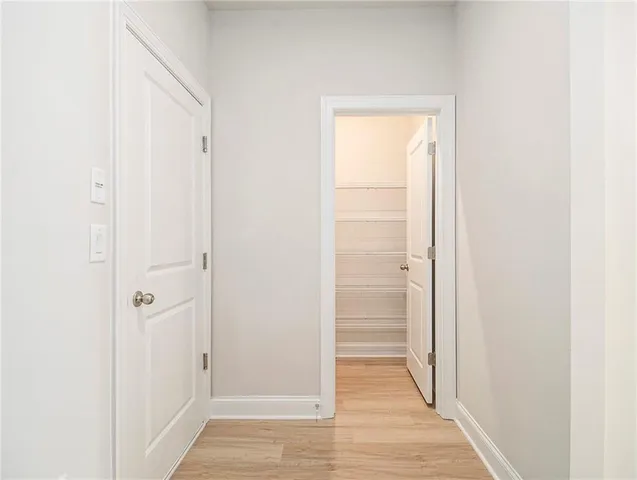 a view of a bathroom with wooden floor