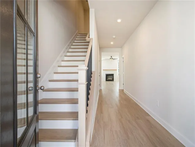 a view of entryway with wooden floor