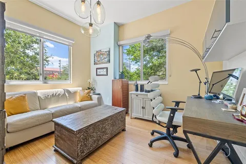a bathroom with a granite countertop sink a toilet and shower