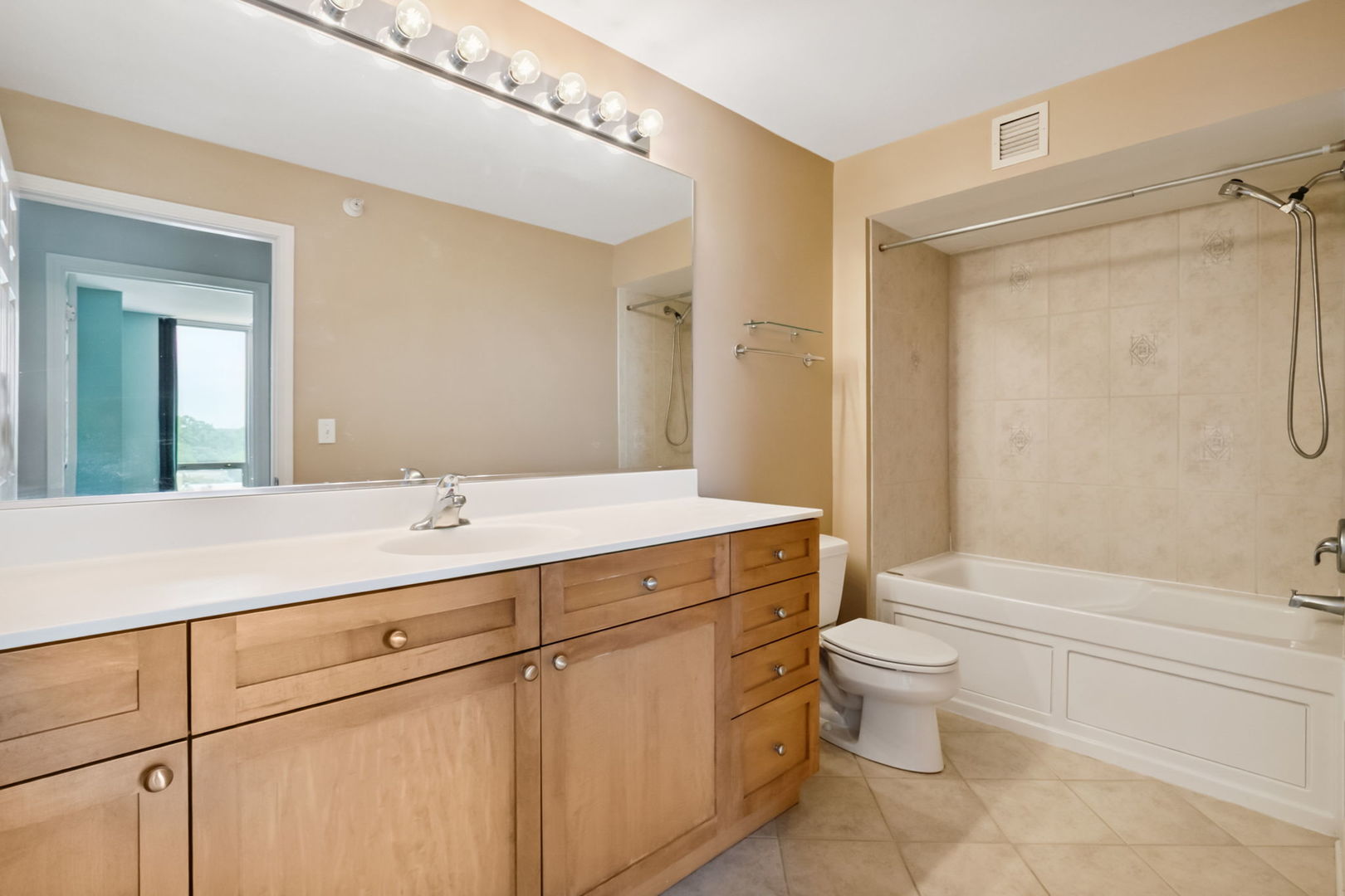 1640 Maple Avenue, Unit 903 Evanston, IL 60201 - Photo 13 of 24 a bathroom with a sink a toilet and shower