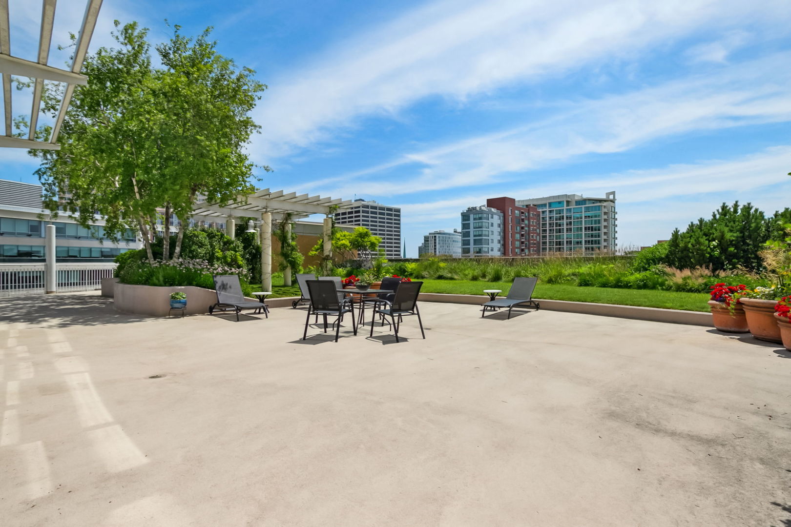 1640 Maple Avenue, Unit 903 Evanston, IL 60201 - Photo 19 of 24 a view of a patio with a table and chairs under an umbrella