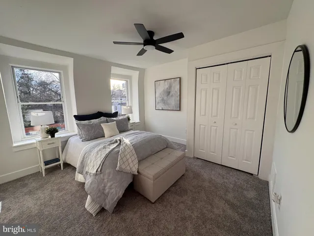 a bedroom with a bed and window