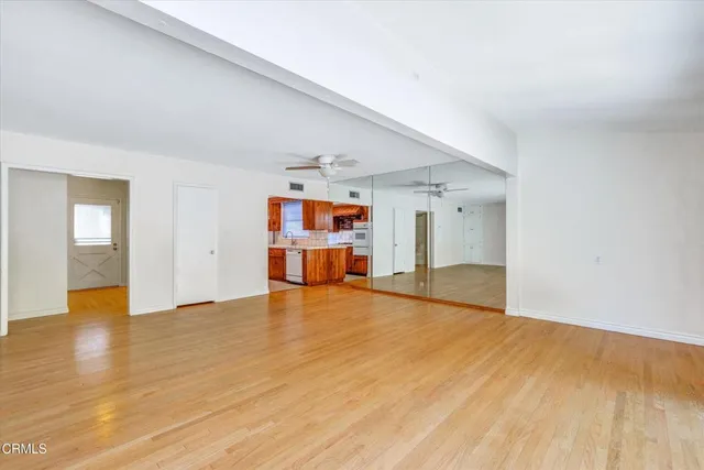 a kitchen with stainless steel appliances a sink and a refrigerator