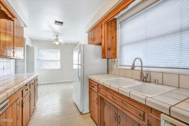 a bathroom with a sink a vanity and a mirror