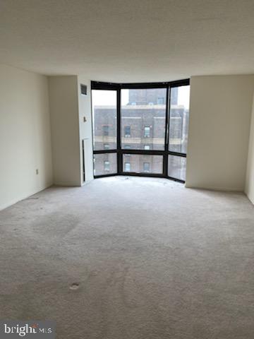 an empty room with large window