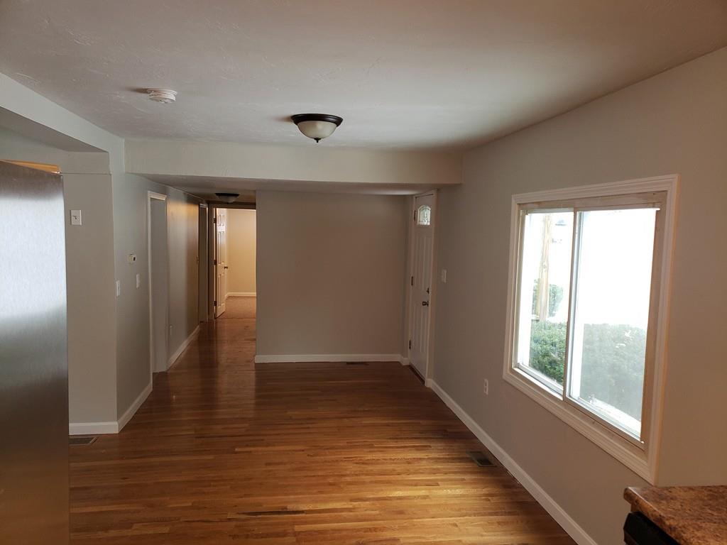 59 Old Poor Farm Road Ware, MA 01082 - Photo 8 of 15 a view of an empty room with wooden floor and a window