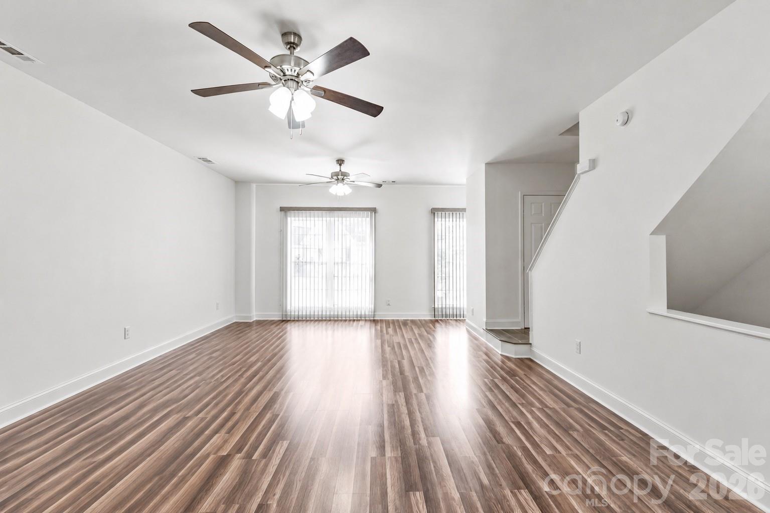 1707 Kashmir White Lane Fort Mill, SC 29708 - Photo 14 of 33 wooden floor in an empty room with a window