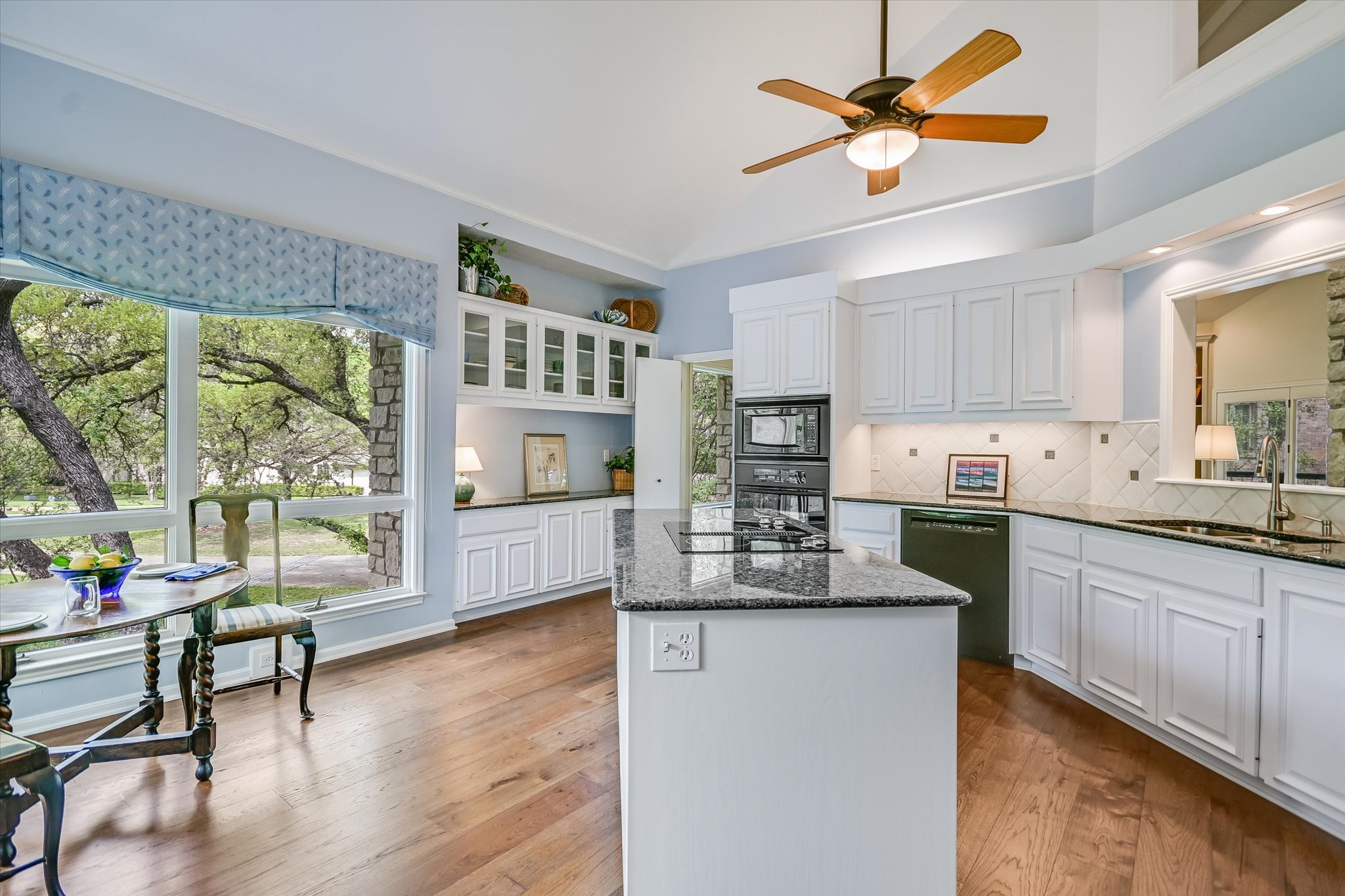3901 Prentice Lane Austin, TX 78746 - Photo 8 of 40 The kitchen is centrally located and opens effortlessly to the dining and living areas.