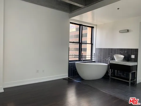 a living room with a couch and a window