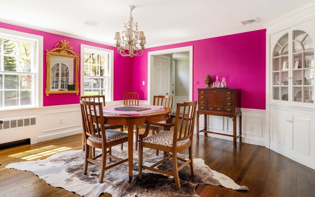 81 Hampshire Road Wellesley, MA 02481 - Photo 12 of 28 a view of a dining room with furniture a chandelier and wooden floor