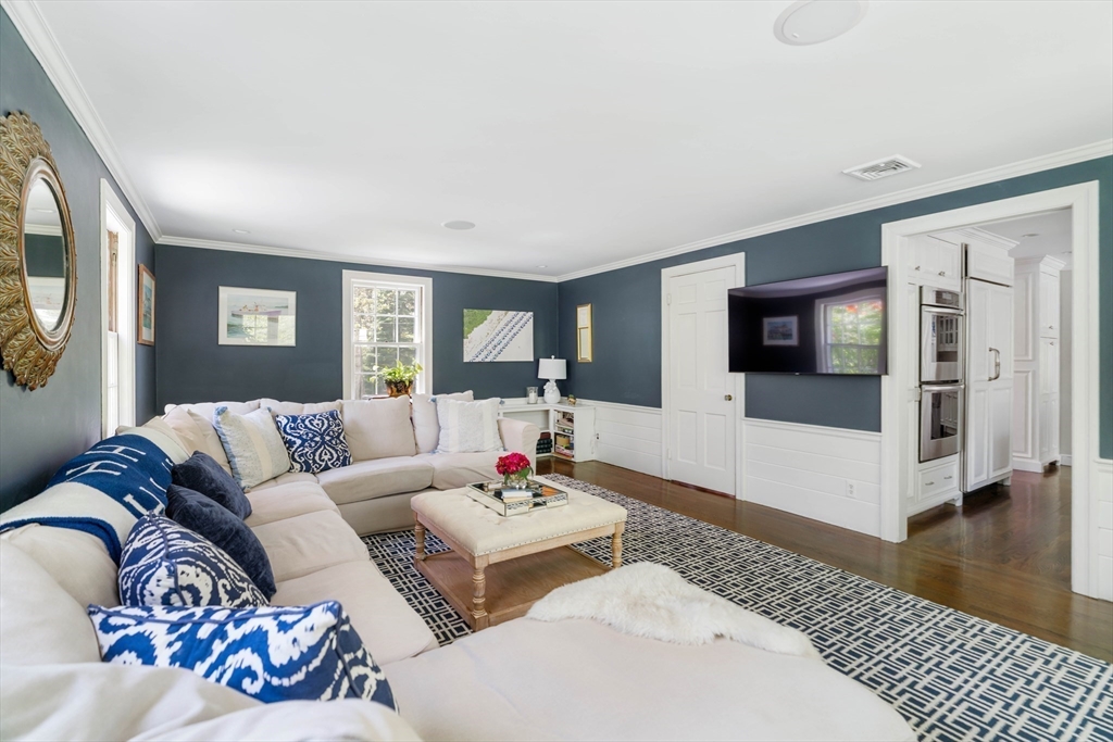 81 Hampshire Road Wellesley, MA 02481 - Photo 14 of 28 a living room with furniture and a flat screen tv