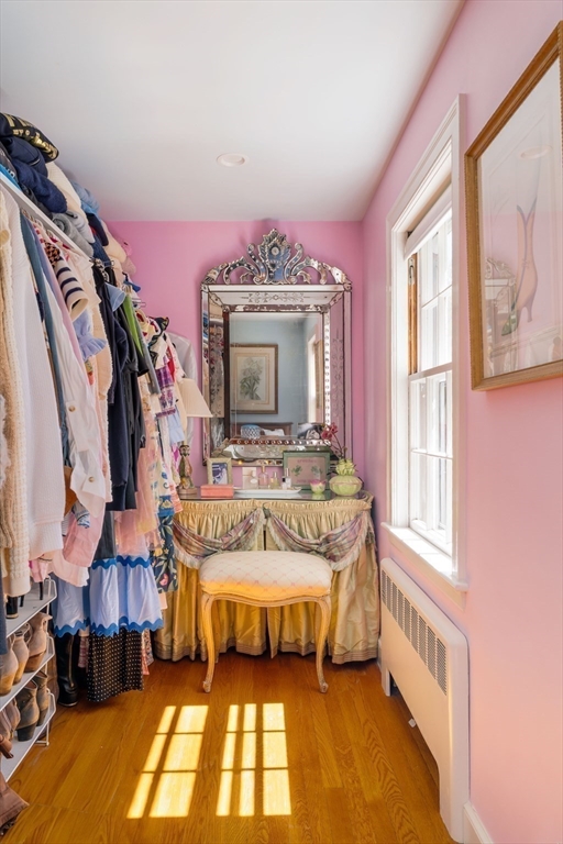 81 Hampshire Road Wellesley, MA 02481 - Photo 19 of 28 a view of a bedroom with a bed and a fireplace