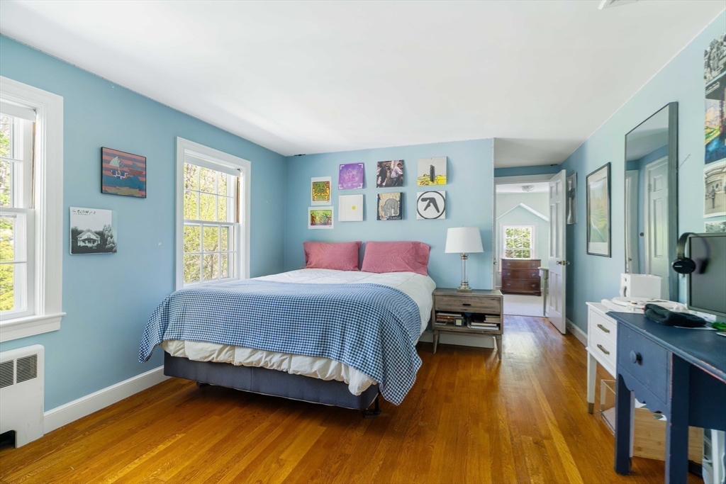 81 Hampshire Road Wellesley, MA 02481 - Photo 20 of 28 a bedroom with a bed and wooden floor