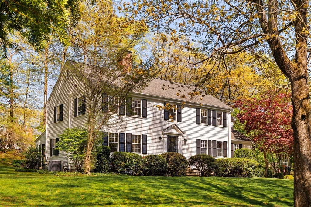 81 Hampshire Road Wellesley, MA 02481 - Photo 2 of 28 a front view of a house with a garden