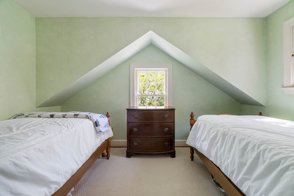 81 Hampshire Road Wellesley, MA 02481 - Photo 21 of 28 a bedroom with a bed and a window