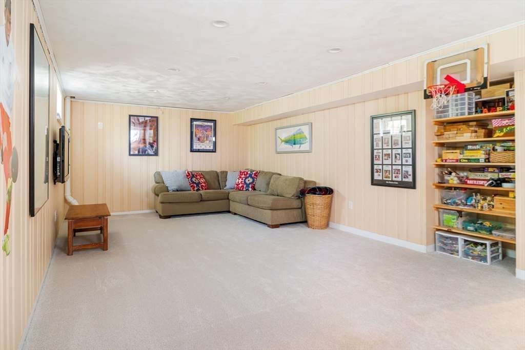 81 Hampshire Road Wellesley, MA 02481 - Photo 25 of 28 a living room with furniture and a book shelf