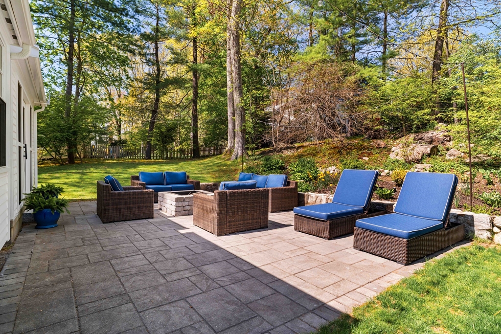 81 Hampshire Road Wellesley, MA 02481 - Photo 28 of 28 a view of a patio with chairs and a potted plant