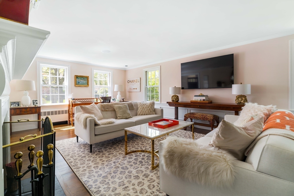 81 Hampshire Road Wellesley, MA 02481 - Photo 5 of 28 a living room with furniture and a flat screen tv