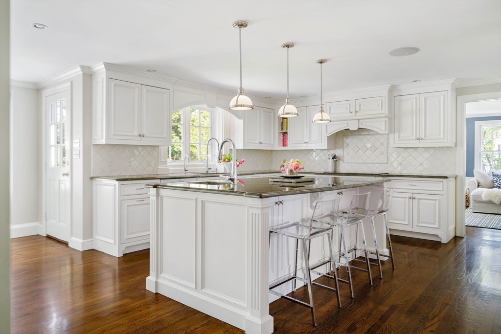 81 Hampshire Road Wellesley, MA 02481 - Photo 8 of 28 a kitchen with stainless steel appliances granite countertop a white cabinets and wooden floor