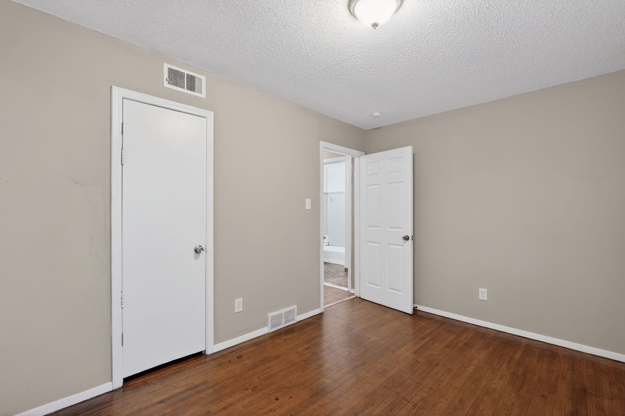 4314 Ford Road Memphis, TN 38109 - Photo 25 of 31 a view of an empty room with wooden floor