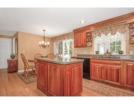 78 Fairview Park Road Sturbridge, MA 01566 - Photo 8 of 30 a kitchen with granite countertop a stove a sink dishwasher and cabinets with wooden floor