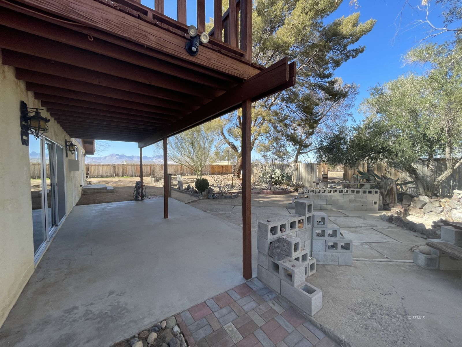 1562 West Reeves Avenue Ridgecrest, CA 93555 - Photo 26 of 45 a view of a porch with a wooden fence