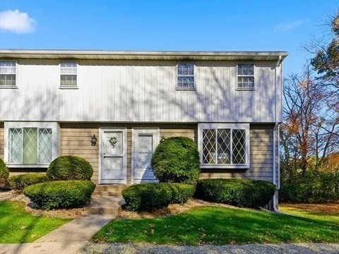 84 Fuller Street, Unit 1 Ludlow, MA 01056 - Photo 2 of 34 a front view of a house with garden