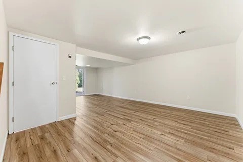 84 Fuller Street, Unit 1 Ludlow, MA 01056 - Photo 26 of 34 a view of an empty room with wooden floor
