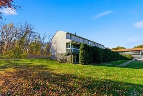 84 Fuller Street, Unit 1 Ludlow, MA 01056 - Photo 32 of 34 a view of a backyard with large trees