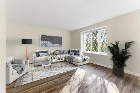 84 Fuller Street, Unit 1 Ludlow, MA 01056 - Photo 4 of 34 a living room with furniture and a large window